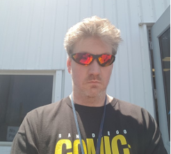 Tim Shuman sport a San Diego Comic-Con T-Shirt and some sweet shades.